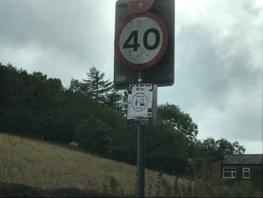 Eyesore Sign Attached to Street Furniture